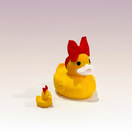 Rubber Duck Duo — large and tiny yellow ducks with red bows